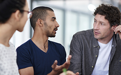 Three men chatting