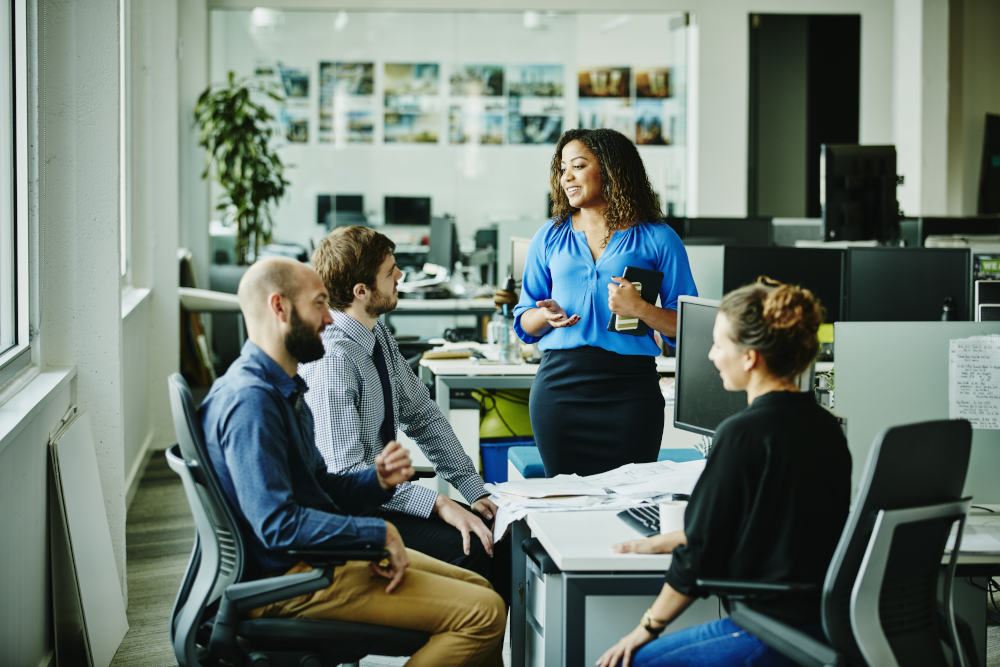 A business training session with an enterprise team discussing IT and business capabilities