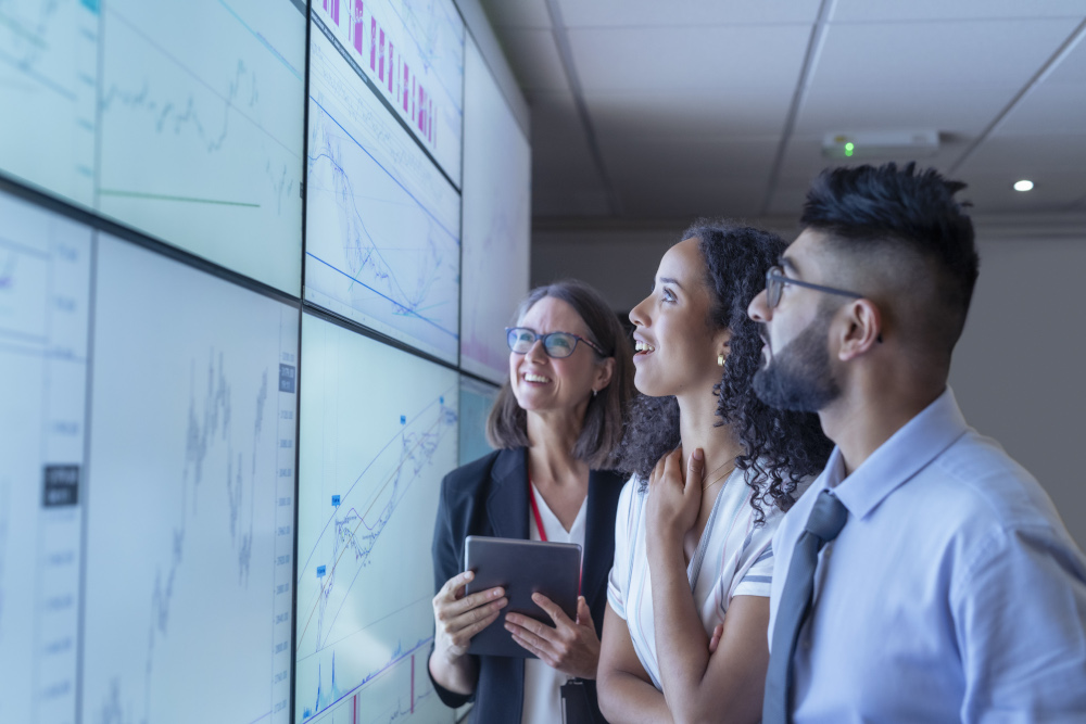 IT professionals analyzing business data and analytics on an enterprise technology dashboard